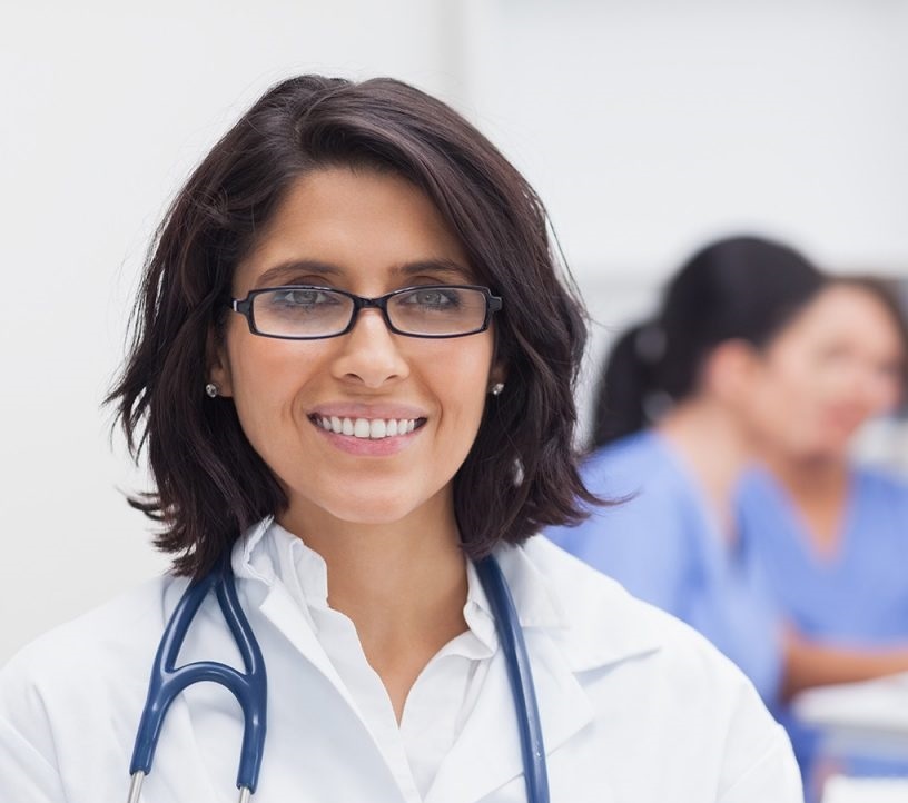 doctor-smiling-and-her-team-on-background-xxl-cropped-1200x800.jpg